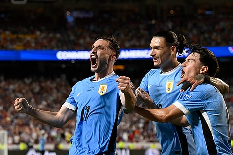 Matias Vina celebrates Uruguay's opening goal against United States
